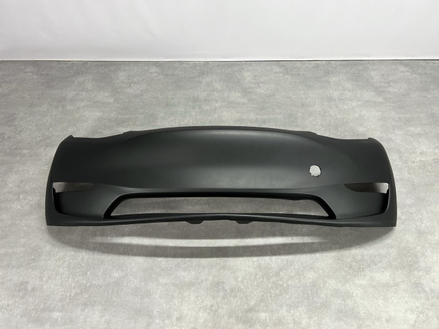 Передній бампер (без отворів під парк.) - Tesla Model Y (1493736-S0-A)